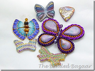Butterfly pendants and brooches